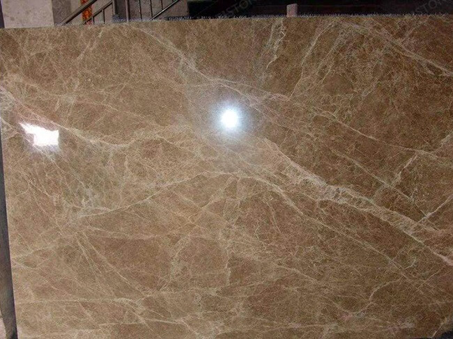 close up of polished light emperador marble tiles